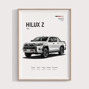 Puede incluir: Impresión enmarcada de una camioneta Toyota Hilux Z 2024 blanca. La imagen incluye especificaciones: motor 2.393cc, potencia 150hp, par 400Nm, peso 2.010kg y una velocidad máxima de 170km/h. El logotipo de Toyota Offroad está en la parte superior.