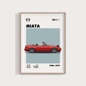 May include: Framed print featuring a red Miata convertible car illustration. The poster includes the car's specifications: 133 hp, 8.6 sec, 950 kg, 1.8 L, 190 km/h, and 136 N/m. The production years are listed as 1989-1997. The car is set against a light blue background.