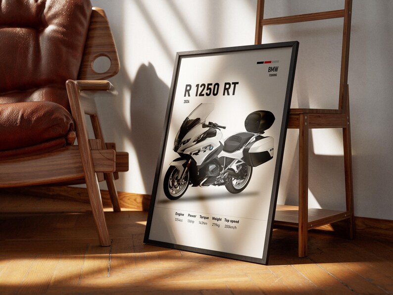 May include: A framed poster featuring a white and black BMW R 1250 RT motorcycle. The poster includes specifications such as engine size, power, torque, weight, and top speed. The poster is leaning against a wall near a wooden chair and a wooden shelf.
