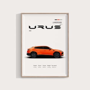 May include: Orange Lamborghini Urus car poster with black wheels and the text "URUS 2025". The poster includes engine specifications: 3.996cc, 800hp, 950Nm, 2.350kg, and 305km/h top speed. The poster is framed.