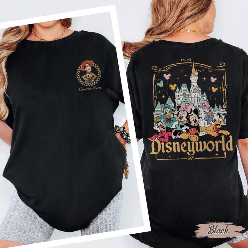 May include: Black t-shirt featuring a Woody cartoon character on the front and a Disneyworld graphic on the back. The Disneyworld graphic includes Mickey and Minnie Mouse, Donald and Daisy Duck, and other characters. The text "Custom Name" is also visible.