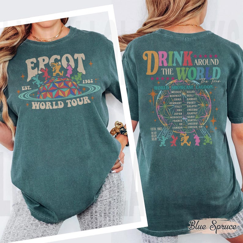 May include: Teal-colored t-shirt with "EPCOT World Tour" graphic on the front, featuring a colorful geometric design and the text "EST. 1982." The back displays "Drink Around The World" with a globe design and country names.