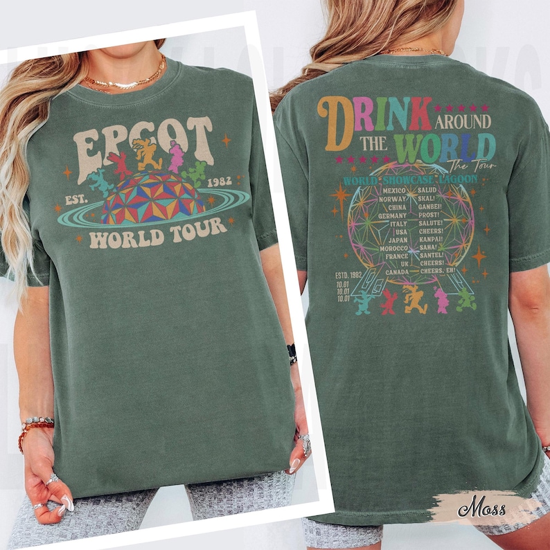 May include: Green t-shirt with "EPCOT World Tour" graphic on the front, featuring a retro design with the year 1982. The back of the shirt says "Drink Around the World" with a globe graphic and country names. The shirt is a moss green color.