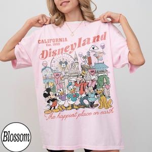 May include: A set of three ceramic mugs with a speckled, matte finish. The mugs are in cream, light grey, and dark grey. Each mug has a simple, minimalist design, ideal for coffee or tea.