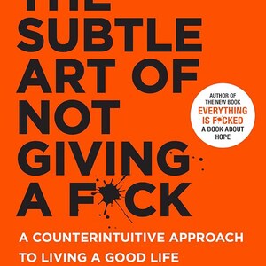 May include: A book cover with an orange background and black text. The title is "The Subtle Art of Not Giving a F*ck" by Mark Manson. The subtitle is "A Counterintuitive Approach to Living a Good Life".