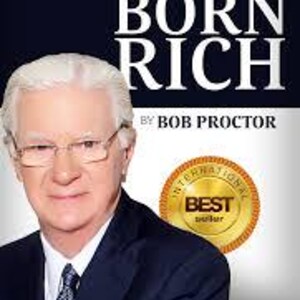 May include: Book cover with a white background and black text that reads "You Were Born Rich" by Bob Proctor. The author's name is in a smaller font size below the title. A photo of Bob Proctor is on the left side of the cover. A gold seal with the text "International Best Seller" is on the right side of the cover.