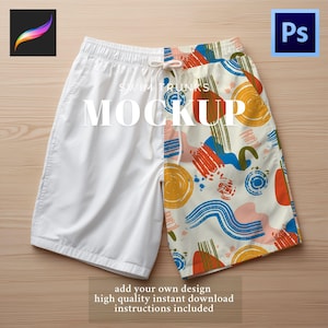 May include: Swim trunks mockup, split down the middle. One side is plain white, the other has a colorful abstract pattern with orange, blue, and yellow shapes on a cream background. The word "MOCKUP" is displayed in large white letters.