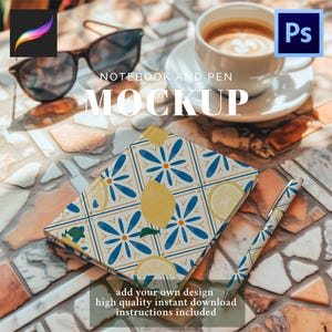 May include: A notebook and pen mockup with a lemon and floral design. The notebook and pen have a matching pattern of yellow lemons and blue flowers. Sunglasses and a cup of coffee are also on the table. The text "NOTEBOOK AND PEN MOCKUP" is displayed.