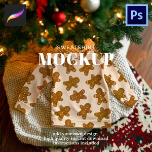 May include: A beige sweatshirt mockup featuring a repeating pattern of gingerbread men with brown and green details. The text "SWEATSHIRT MOCKUP" is displayed above the garment. Additional text at the bottom reads "add your own design high quality instant download instructions included".