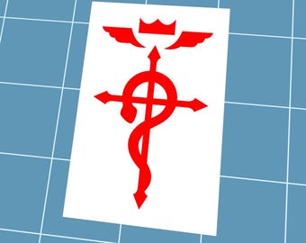May include: A red alchemical symbol sticker on a white background. The symbol features a cross, snake, wings, and crown design. The sticker is on a blue grid surface.