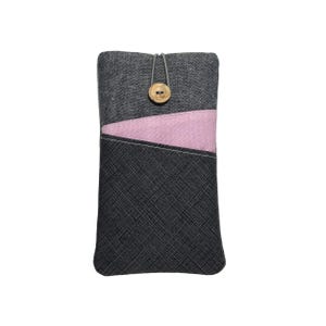 May include: A grey and pink fabric phone case with a button closure.