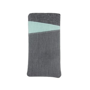 May include: A grey and light blue fabric phone case with a striped pattern.