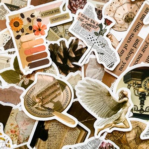 May include: A collection of vintage-style stickers with various designs. Includes a sunflower, coffee beans, a slice of cake, a winged figure, and text that reads "A LITTLE BIT CONFUSED" and "I THINK YOU ARE THE SWEETEST THING".
