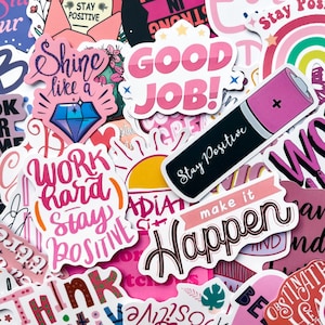 May include: A selection of vibrant stickers with positive messages and designs. The stickers display phrases such as "Stay Positive," "Good Job," and "Work Hard, Stay Positive." The color scheme includes pink, white, and black.