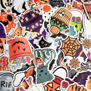 May include: A collection of Halloween-themed stickers featuring various designs. Includes images of a haunted house, black cat, spiderwebs, jack-o'-lanterns, candy, and a skeleton hand holding a pumpkin. The stickers are colorful with a white border.