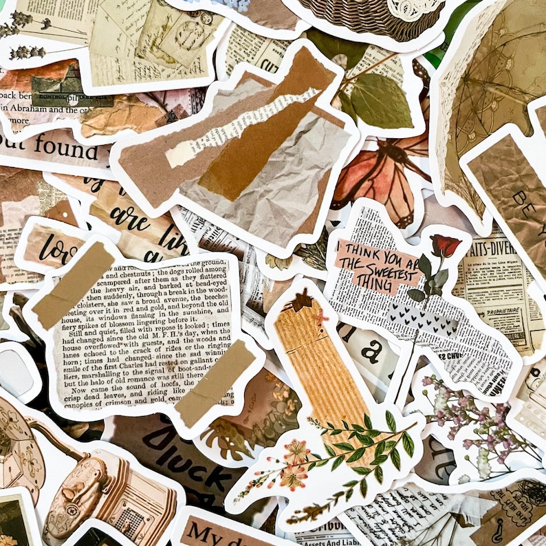 May include: A collection of vintage-style stickers with various designs. The stickers feature torn paper, floral elements, newspaper clippings, and handwritten text. Colors include beige, brown, and white, creating a collage aesthetic.
