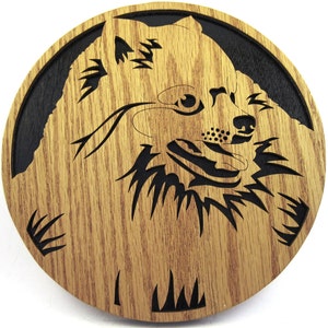 Wall plaque of a Pomeranian dog scroll saw cut