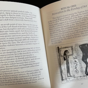 May include: An open book page featuring text titled RITUAL ONE Invocation to the Foreleg of Set. The page includes a black and white illustration labeled The Goddess Nut with the Foreleg of Set, depicting a figure and a leg symbol with stars.