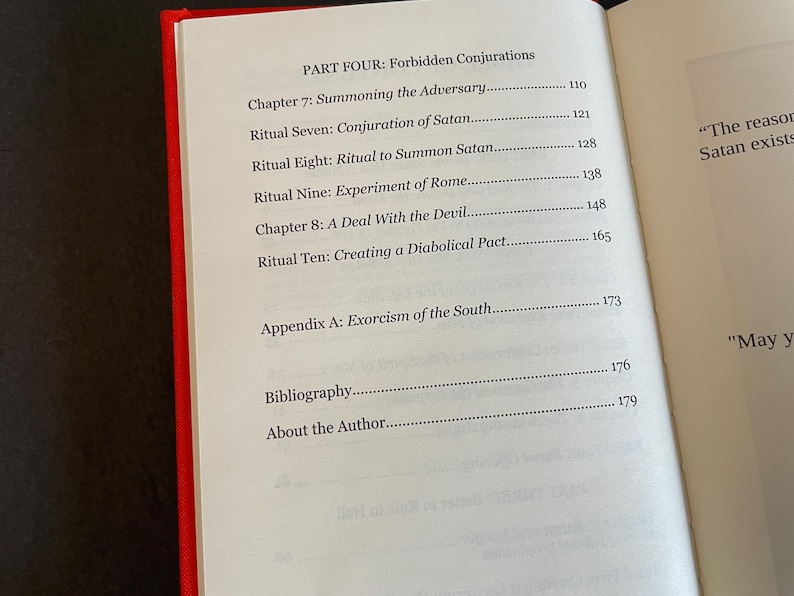 May include: An open book with a red spine showing a table of contents page titled PART FOUR: Forbidden Conjurations. The list includes Chapter 7: Summoning the Adversary, Ritual Seven: Conjuration of Satan, Ritual Eight: Ritual to Summon Satan, Ritual Nine: Experiment of Rome, Chapter 8: A Deal With the Devil, Ritual Ten: Creating a Diabolical Pact, Appendix A: Exorcism of the South, Bibliography, and About the Author.