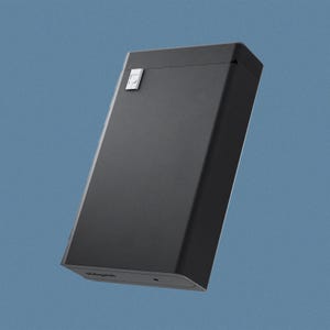 May include: A black rectangular box with a small silver button on the top. The box has a slightly rounded edge and the word "Panga" is printed on the bottom.