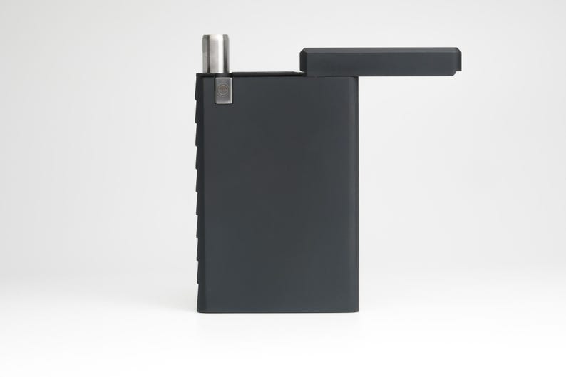 May include: A black rectangular box with a hinged lid. The lid is open and the box is empty.