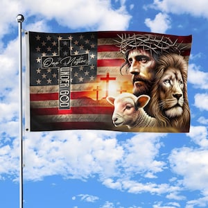 May include: A flag featuring the American flag design with a cross and the text "One Nation Under God." The flag also depicts Jesus wearing a crown of thorns, a lion, and a lamb. The background shows a sunset and crosses.