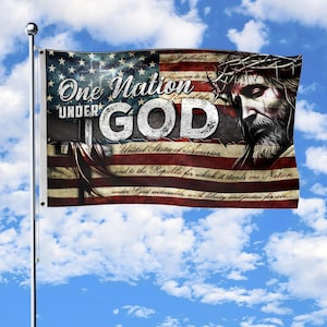 May include: A flag featuring the American flag design with the text "One Nation Under God." The flag also includes an image of Jesus wearing a crown of thorns. The flag is displayed against a blue sky with clouds.