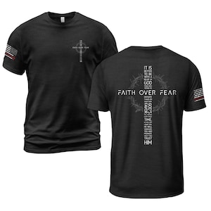 May include: Black t-shirts with the text "FAITH OVER FEAR" and a cross design. One shirt has an American flag on the sleeve. The back of the other shirt has a cross design with text.