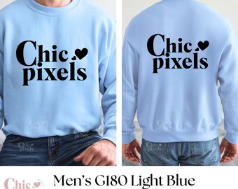 May include: A light blue sweatshirt with the text "Chic pixels" printed on the front and back. The text is in black and features a small heart symbol.