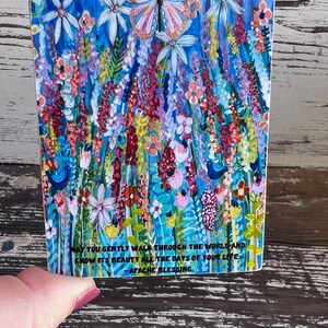 May include: A colorful sticker with a butterfly and flowers. The sticker has a quote that reads: "May you gently walk through the world and know it's beauty all the days of your life. - Apache Blessing"