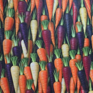 May include: A vibrant, close-up image of a variety of carrots. The carrots are in shades of orange, purple, white, and red, with green tops. The image is a dense pattern of the colorful vegetables.