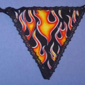 May include: Black lace thong with a flame pattern in red, orange, and yellow.
