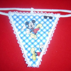 May include: White lace trim g-string with a blue and white checkered pattern and a cartoon image of Mickey Mouse.