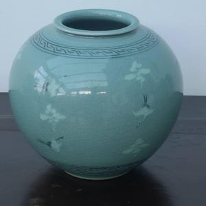 A Vintage Korean Celadon Glazed Moon Jar With Cranes and Clouds