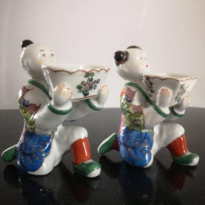 Republic Period  Famille Rose Chinese Porcelain Modelled As Children Supporting Vases