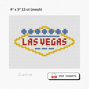May include: A cross-stitch pattern of the iconic Las Vegas sign, featuring a yellow and red diamond shape with the words "LAS VEGAS" in red. The design includes blue star-shaped accents and is 4 inches by 3 inches.