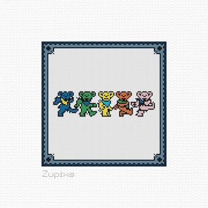 May include: A framed cross-stitch design featuring seven colorful dancing bears. The bears are in a line, each with a different color and design. The frame is blue with a white background. The text "Zupix" is below the frame.