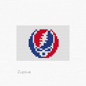 May include: A pixelated image of the Grateful Dead's iconic Steal Your Face logo, featuring a skull with a lightning bolt through it, in red, white, and blue.