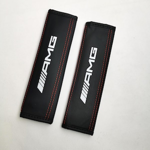 2 Copricinture AMG in pelle nera con logo bianco 260x60