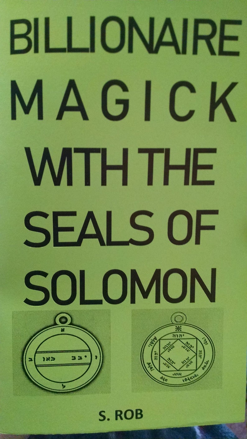 May include: A book cover with the title "BILLIONAIRE MAGICK WITH THE SEALS OF SOLOMON" in large black letters on a light green background. Two circular illustrations of seals are below the title, with text in Hebrew. The author's name, S. ROB, is at the bottom.