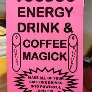 May include: Pink booklet with black text that reads "VOODOO ENERGY DRINK & COFFEE MAGICK" with two black and white illustrations of coffee mugs with lightning bolts. The text below the illustrations reads "MAKE ALL OF YOUR CAFFEINE DRINKS INTO POWERFUL SPELLS!" and "S. ROB".