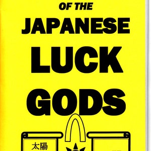 May include: A yellow book cover with black text that reads "MAGIC OF THE JAPANESE LUCK GODS". There are three black and white illustrations of scrolls with Japanese text on them. The text on the scrolls reads "大阪ビジョン" and "公開".