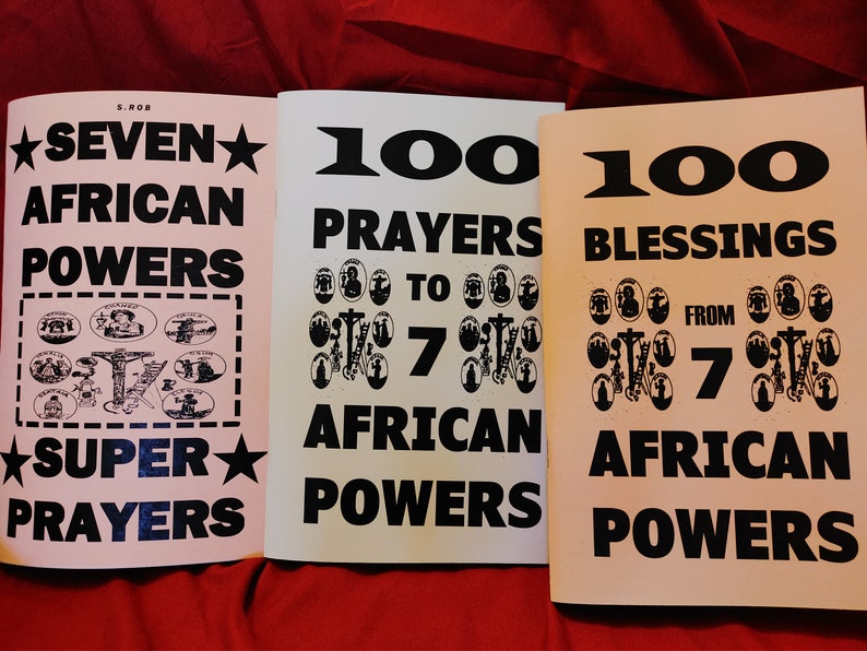 Op de afbeelding: Drie roze en witte paperback boeken met zwarte tekst. De boeken zijn getiteld "Seven African Powers Super Prayers", "100 Prayers to 7 African Powers" en "100 Blessings from 7 African Powers".