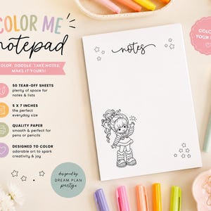 May include: A white rectangular notepad with the text COLOR ME notepad and notes printed at the top. The page features a black and white line drawing of a character with curly hair, stars, and 50 tear-off sheets measuring 5 by 7 inches.