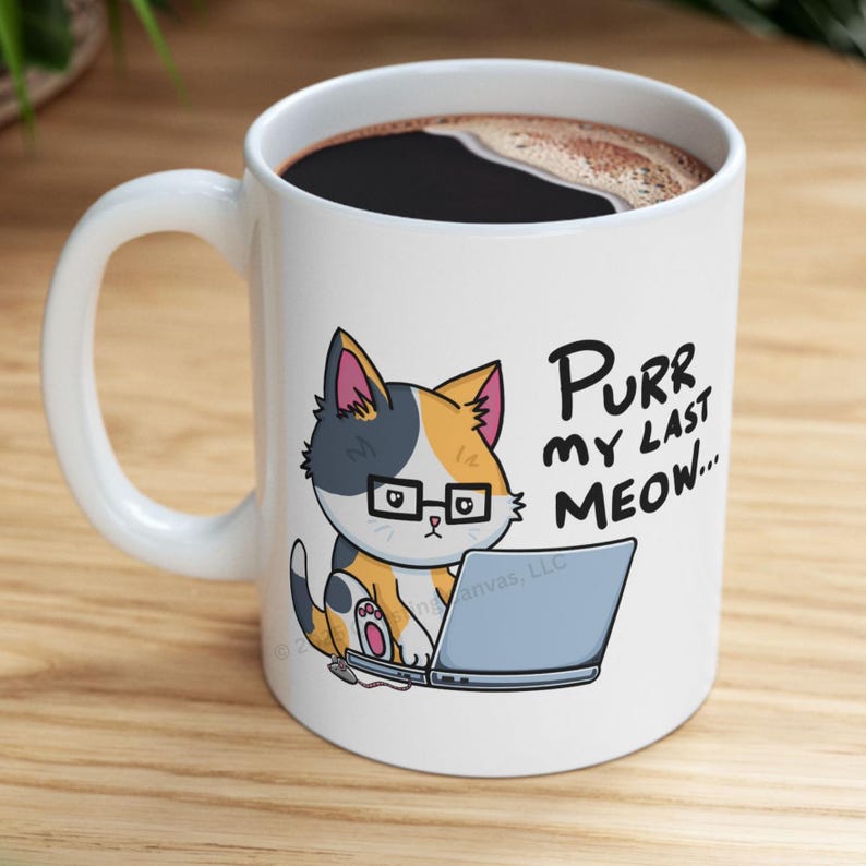 A funny design of a cat working on a computer. A cat wearing glasses sits in front of a laptop. Next to the cat on the floor is a little mouse with a 2 ears and a nose. Its tail connects into the side of the cat's laptop. The cat is looking down at the computer. The caption for the design says: "PURR MY LAST MEOW.” Perfect gift for the sarcastic coworker, employee recognition idea or team building gift.