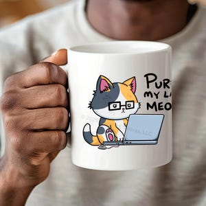 A funny design of a cat working on a computer. A cat wearing glasses sits in front of a laptop. Next to the cat on the floor is a little mouse with a 2 ears and a nose. Its tail connects into the side of the cat's laptop. The cat is looking down at the computer. The caption for the design says: "PURR MY LAST MEOW.” Perfect gift for the sarcastic coworker, employee recognition idea or team building gift.