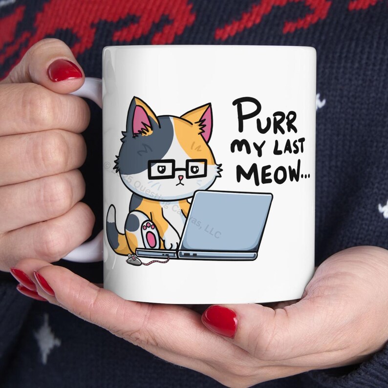 A funny design of a cat working on a computer. A cat wearing glasses sits in front of a laptop. Next to the cat on the floor is a little mouse with a 2 ears and a nose. Its tail connects into the side of the cat's laptop. The cat is looking down at the computer. The caption for the design says: "PURR MY LAST MEOW.” Perfect gift for the sarcastic coworker, employee recognition idea or team building gift.