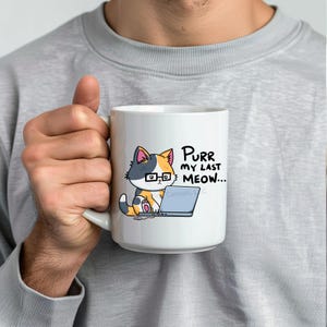 A funny design of a cat working on a computer. A cat wearing glasses sits in front of a laptop. Next to the cat on the floor is a little mouse with a 2 ears and a nose. Its tail connects into the side of the cat's laptop. The cat is looking down at the computer. The caption for the design says: "PURR MY LAST MEOW.” Perfect gift for the sarcastic coworker, employee recognition idea or team building gift.