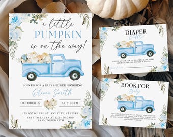 May include: Baby shower invitation set featuring a blue pickup truck carrying pumpkins. The main invitation reads "a little pumpkin is on the way!" with floral accents. Includes diaper raffle and book for baby cards. The set is decorated with blue and white pumpkins.