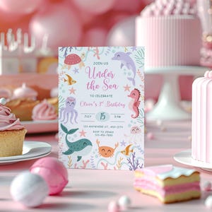 May include: A birthday party invitation with an "Under the Sea" theme, featuring illustrations of sea creatures like a whale, seahorse, and octopus. The invitation is surrounded by pink decorations, cupcakes, and a cake. The text reads "Join Us Under the Sea to Celebrate Olivia's 3rd Birthday."